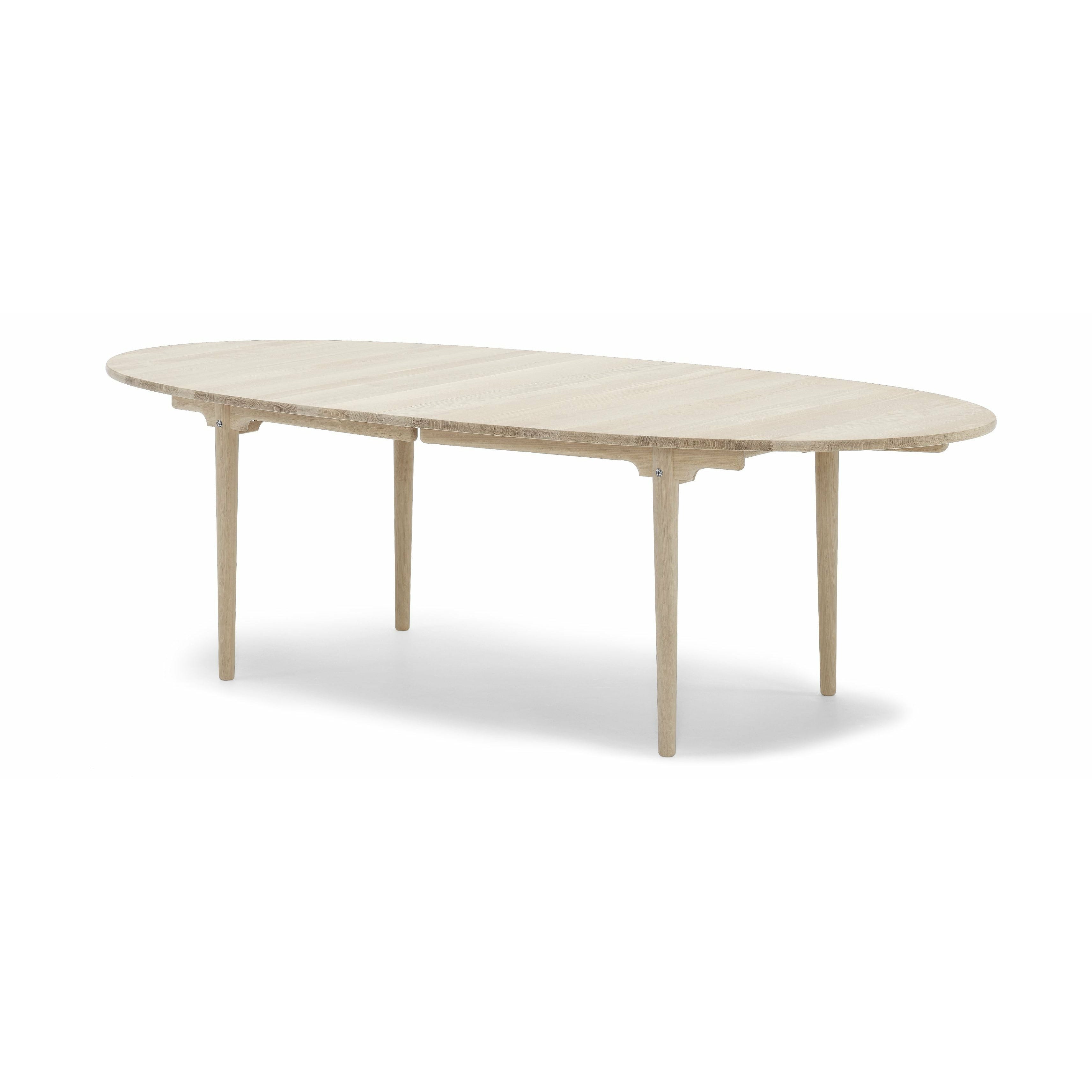 Jídelní stůl Carl Hansen CH339 navržený pro 4 vytáhnout talíře, mýdlový dub