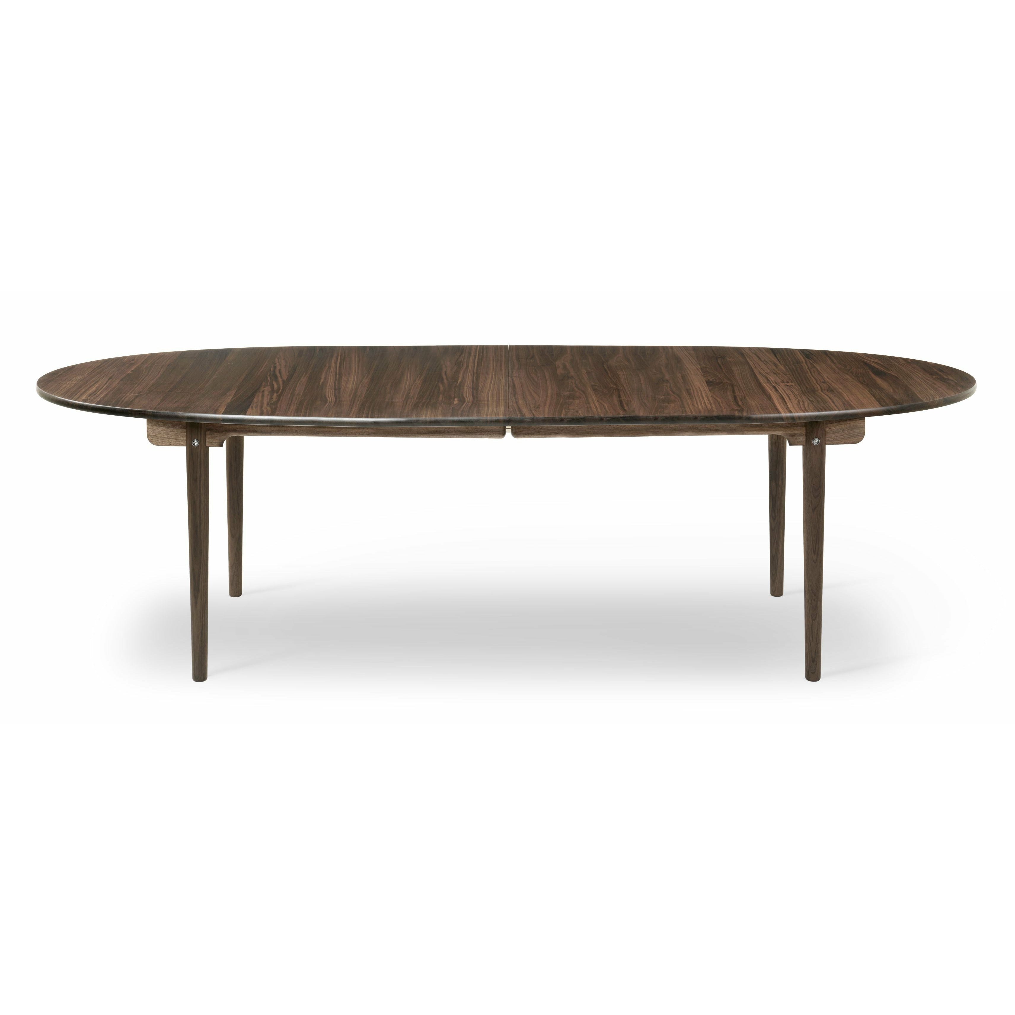 Jídelní stůl Carl Hansen CH339 navržený pro 4 vytahovací talíře, ořechový ořech